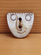 Hand carved - face - button