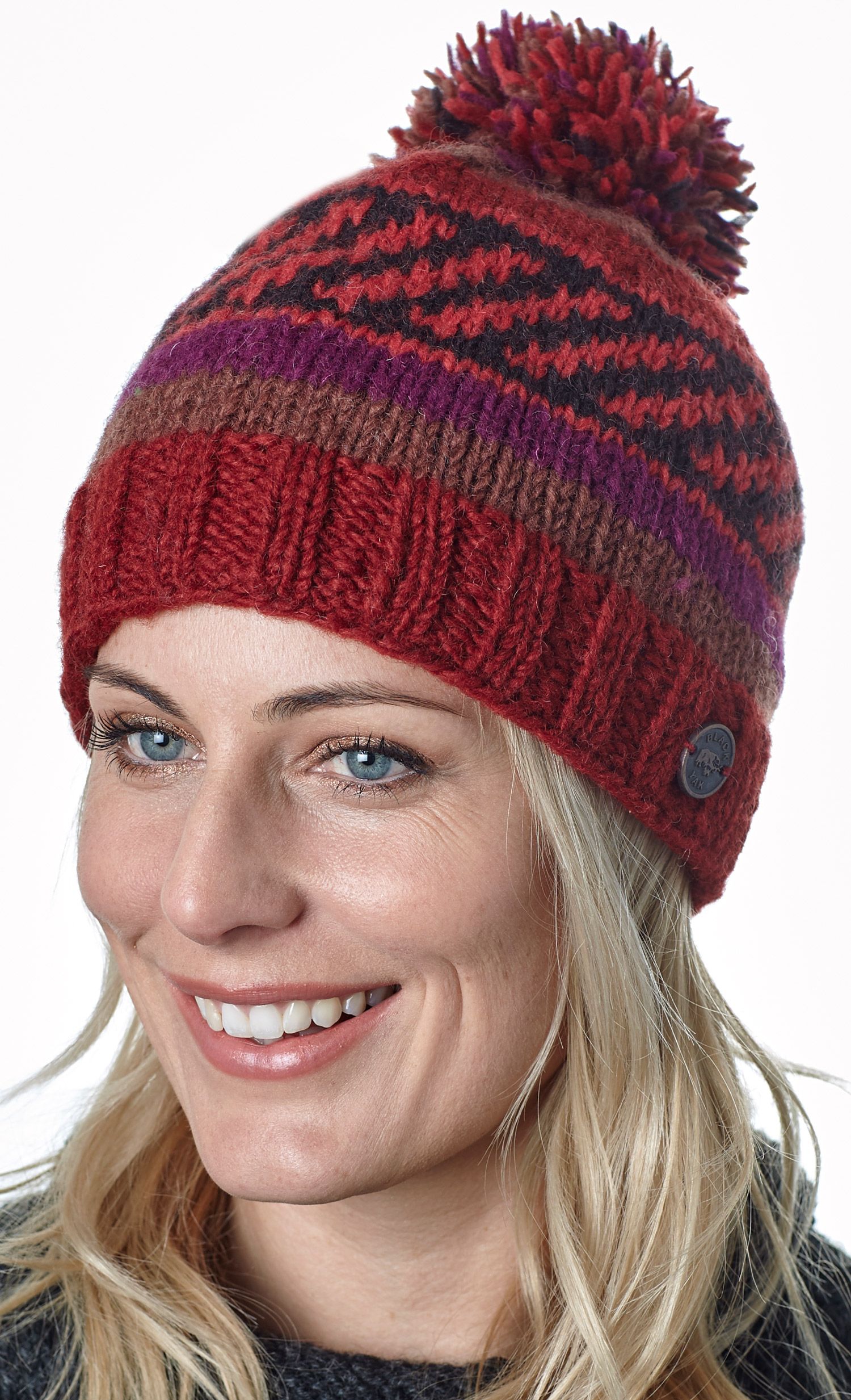 Multi patterned hand knit bobble hat Autumn Black Yak