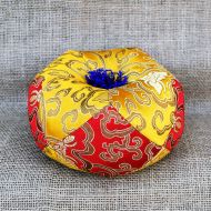 Singing bowl cushion - red/gold with blue tassels
