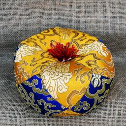 Singing bowl cushion - gold/blue with red tassels