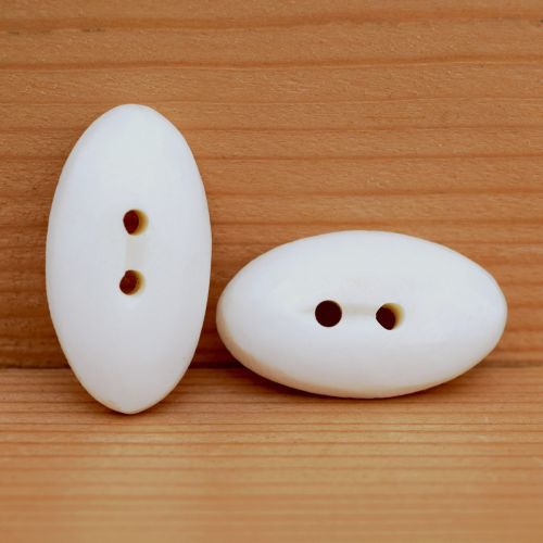 Smooth carved - cream oval - button