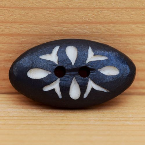 Beautifully hand carved - small leaf pattern - oval button